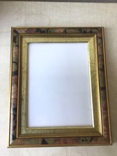 Cadre mural en bois à motifs et dorures