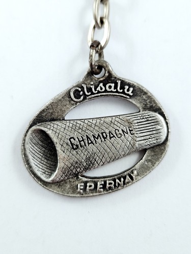 Porte cles capsuleuses - -,