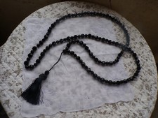 1 Sautoir ancien avec pompon en plastique noir