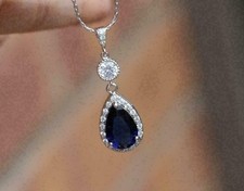 Pendentif halo saphir bleu