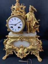 Pendule de cheminée Napoléon III au personnage masculin champêtre en métal doré