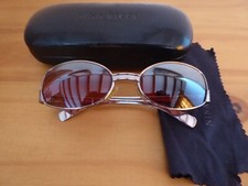 NINA RICCI Lunettes de soleil forme ovale femme métal rosé Etat correct