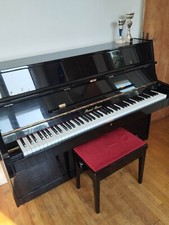 piano Pearl river  noire  plus banquette a vendre tres bon etat