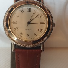 Montre mixte  vintage quartz pile incluse bracelet neuf chiffres romains