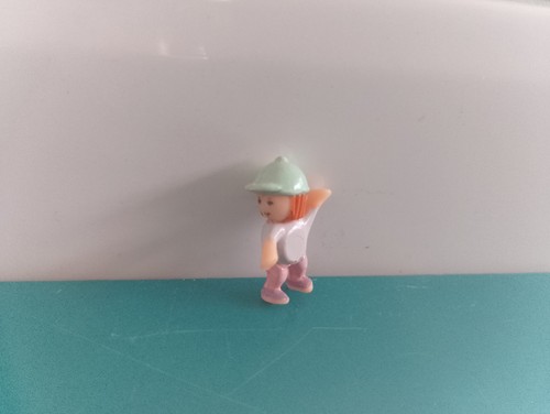 Polly pocket figurine doll