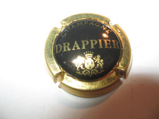 1 capsule de champagne  Drappier N°24 noir contour or verso or