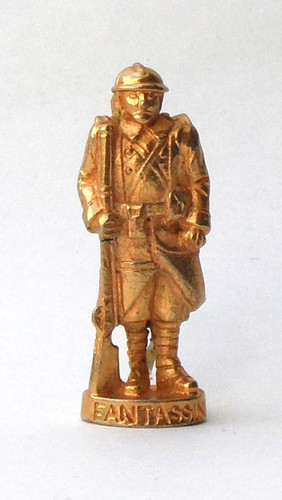 Fève métal doré soldat - -,