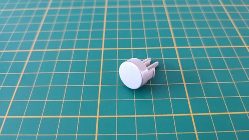 Bouton gris reset pièce