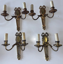 PETITOT   Suite de 4 appliques médaillon art déco en bronze doré