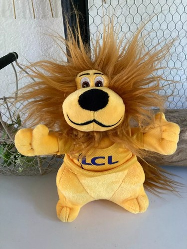 Peluche le lion jaune - le,