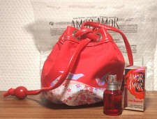 Rare. Mini Bourse et Eau de Toilette Amor Amor de Cacharel 5 ml. Très bon état 