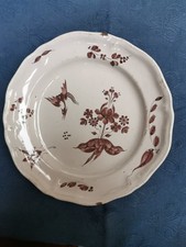 LUNEVILLE XVIIIe.. Assiette  en faïence à décor oiseau fantastique.