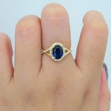 Bague de fiançailles saphir bleu coupe ovale 3,30 ct en or jaune 14 carats