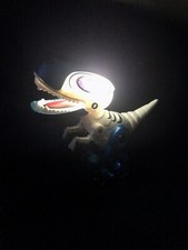 🦖 Dinosaure articulé. Sons et lumières . - NEUF -.