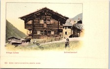 SUISSE - Un chalet dans un village suisse.