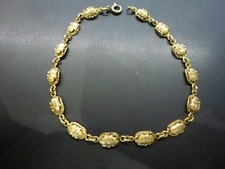 gourmette egyptienne aux 14 scarabés recto/verso en or 18k,L 20cm,P 5,89g