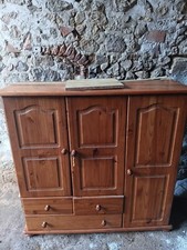 meubles  tv bois marron clair 3 porte ,3 tiroirs.avec une petite penderie.