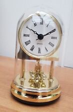 petite horloge à poser, Quartz, pendule rotatif, dorée sous dome plexi, Germany 