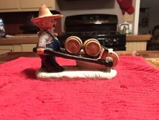 Farmer With Wheelbarrow &