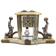 Pendule aux otaries socle onyx