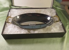 Jean Couzon joli plat creux  de service  aux  anses dorées, jamais utilisé.