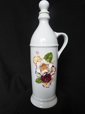 Flacon bouteille à alcool en porcelaine d'Avignon décor fleuri en relief