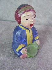 FIGURINE en terre cuite peinte. Origine Japon.
