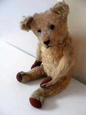 Basile ours ancien né vers 1930 environ remplis de paille hauteur 50cm.