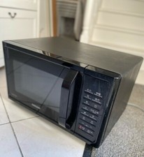 Four micro-onde Samsung / Noir / Bon état / 900 watts