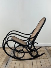 Rocking chair en bois courbé noirci et cannage années 1900