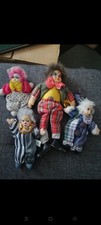 Lot de 4 clowns de collection en porcelaine