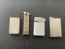 Quatre briquets métal argenté