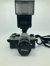 Nikon FA + Nikkor 50 mm f/1.8 + Flash Sunpak Auto 433D + Sacoche + 2 pellicules