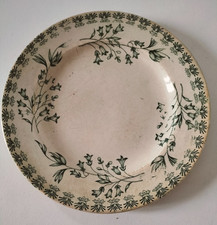 Assiette ancienne terre de fer à décor vert floral, vers 1900