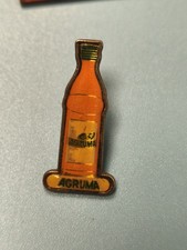 Pin's vintage Agruma bouteille