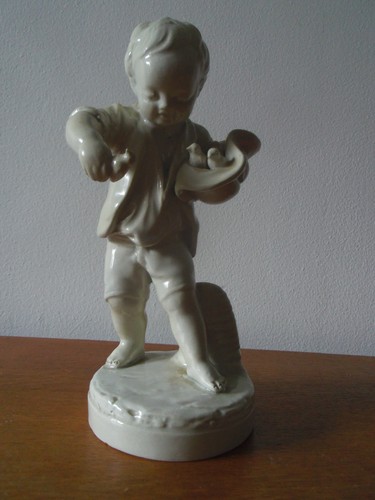 Statuette enfant aux oiseaux