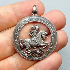 Saint George slays the dragon. Antique Large Openwork Pendant. Silver Medal.