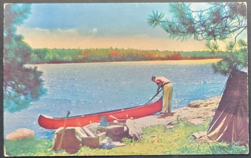 1950s postcard man with canoe - man,