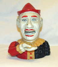 TIRELIRE MECANIQUE ANCIENNE EN FONTE  CLOWN