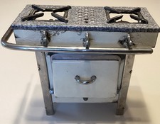 Ancienne cuisinière en fonte émaillée d'enfant / de poupée
