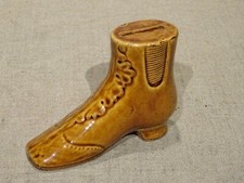 Ancienne tirelire à casser bottine