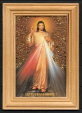 Cadre en bois avec image religieuse et éclats d'ambre de chaque côté du Seigneur