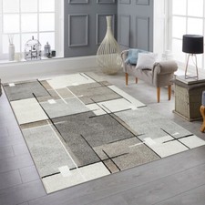 Tapis moderne avec motif graphique en beige, gris et crème - Un accroche-regard