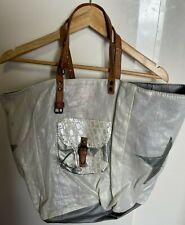 Sac a main Pomponette  en tissue et cuire 