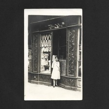 Woman laying front shop
