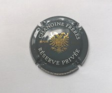 Capsule de Champagne Chanoine Frères réserve privée grise blanche et or