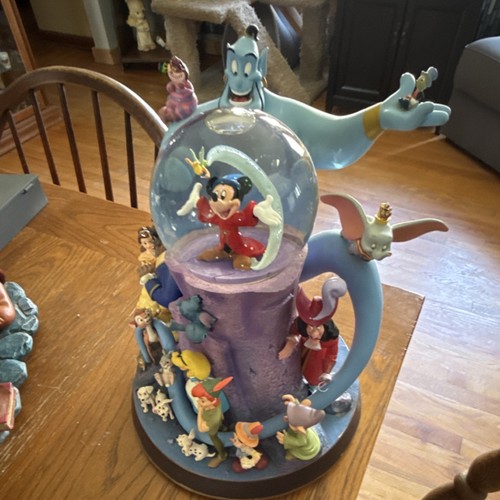 Disney snow globe featuring - snow,