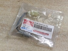 22B-H4312-20 UN SUPPORT D AMPOULE DE VEILLEUSE YAMAHA 125 WR125X WR125R WRX WRR