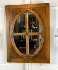 MIROIR OVALE EN TECK DANS UN