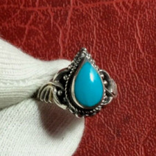 Silver ring with a blue turquoise stone in eye drop